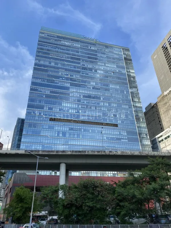 The blue glass facade of TML Tower