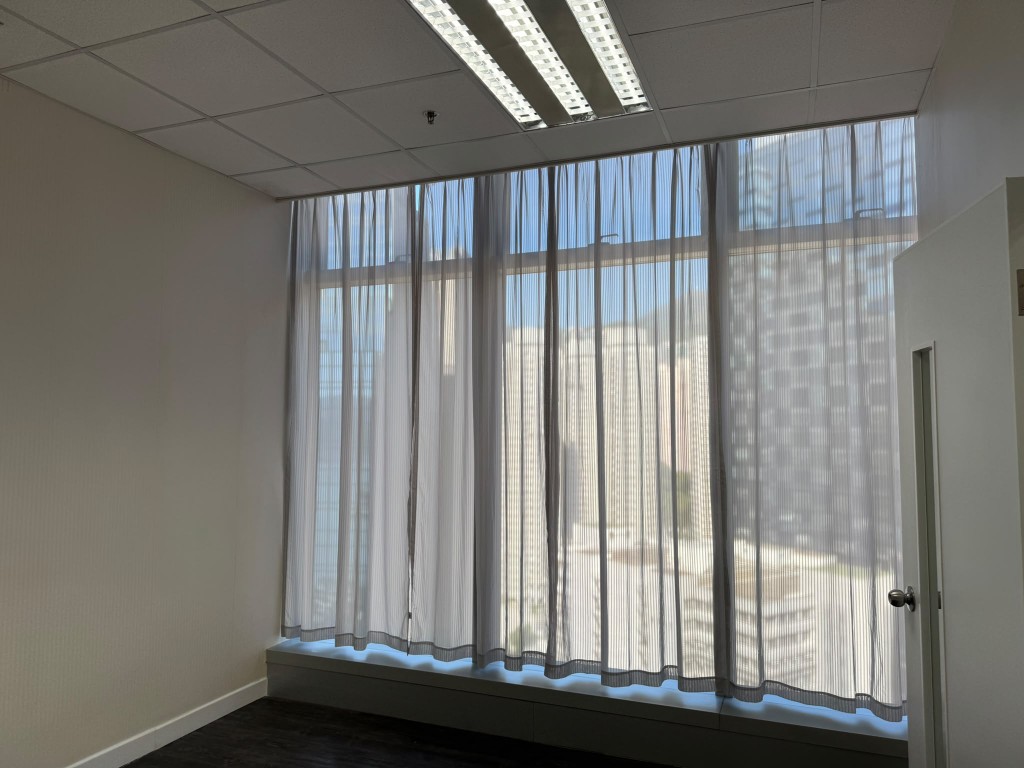 Daylight through sheer curtains in a newly renovated private room